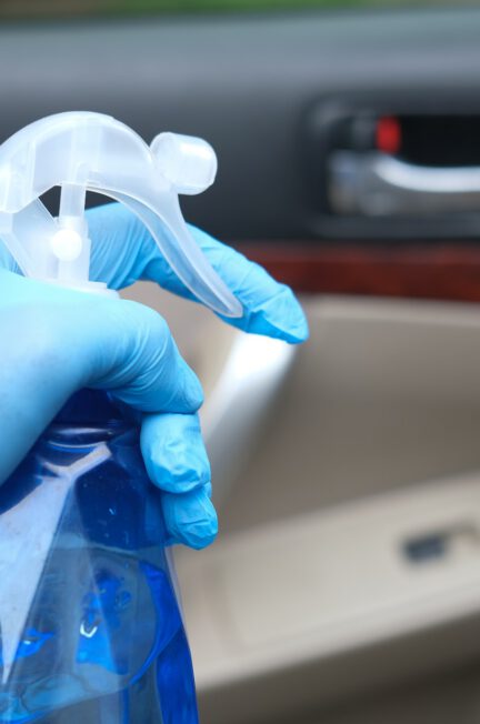 person holding blue and white plastic bottle