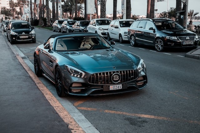 Black sports coupe in road