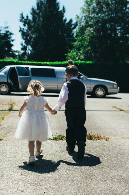 little boy and girl going to limo