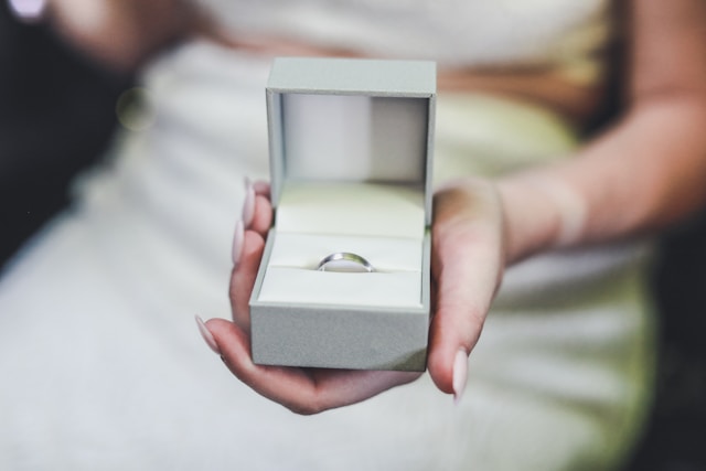 person holding wedding ring