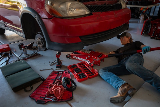a-man-working-on-a-car-in-a-garage